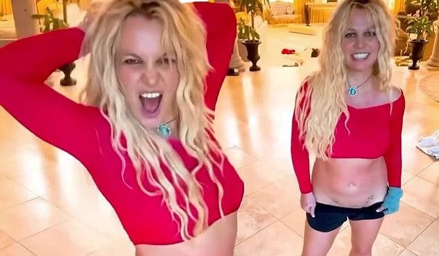 Cover Image for Britney Spears shows off her energetic dance moves in a red crop top and tiny hotpants as she describes herself as ‘a girl who used to be famous way back then’ who ‘makes mistakes’